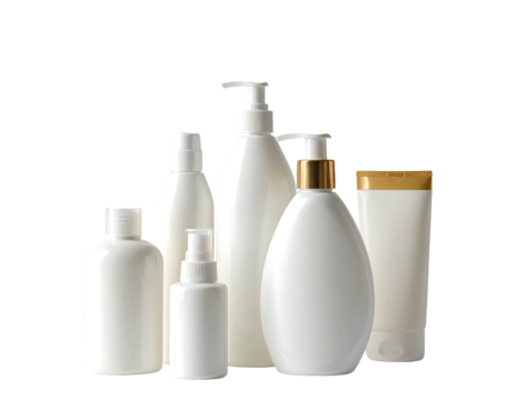 Group of plain white bottles and tubes, various shapes and sizes, on a black background, seemingly for skincare