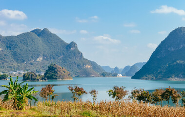 Obraz premium Quyang Lake (Quyanghu) karst peaks landscape reflection in water in Baise city, Guangxi province, China