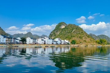 Quyang Lake (Quyanghu)  karst peaks landscape reflection in water in Baise city, Guangxi province, China