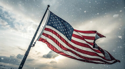 American flag waving in the wind during a snow storm day