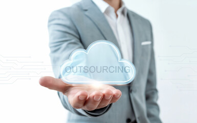 A Businessman in a Suit Holding a Glowing Digital Cloud Icon for a Business Process Outsourcing (BPO) and Global Service Strategy Concept