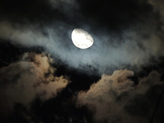The moon plays with the clouds
