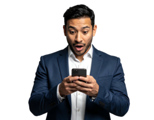 Shocked man in a suit stares at a phone, mouth agape against a black background in a tight waist-up shot
