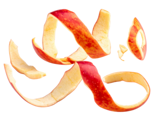 Curving, swirled pieces of red apple peel against a dark background. Fruit skin is twisted in abstract shapes