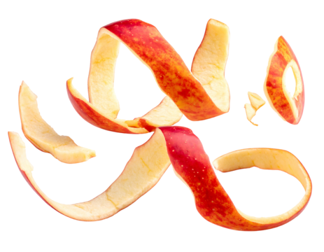 Curving, swirled pieces of red apple peel against a dark background. Fruit skin is twisted in abstract shapes - Powered by Adobe