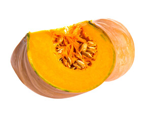 Cut pumpkin with bright orange flesh, seeds exposed; smooth, tan skin; against black backdrop; sharp focus