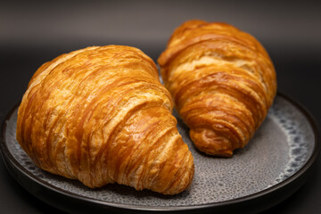 Two Golden Butter Croissants on Ceramic Plate – Freshly Baked French Pastries with Flaky Layers