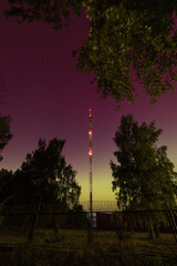 Obraz premium Illuminated Radio Tower Under Starry Night Sky