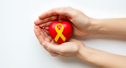 Hands holding a heart with yellow ribbon symbolizing suicide prevention, isolated on white background
