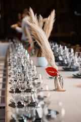 Elegant Wedding Table Setting with Pampas Grass and Anthuriums: Rustic Chic Reception Decor in Neutral Tones and Sophisticated Style