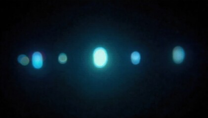 Bioluminescent Light Trails Abstract trails of soft, glowing bioluminescent light in various fluid shapes against a deep, ethereal dark background. Suggests subtle movement and energy. No people or