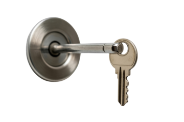 A close-up of a silver key inserted into a round, brushed metal door lock mechanism. background removed
