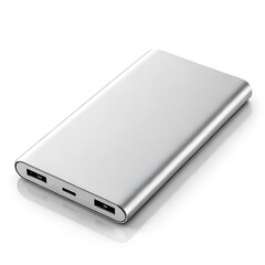A silver power bank lying on a white surface with visible ports and a sleek metallic finish design