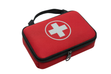 A vibrant red, compact first aid kit, prominently featuring a white medical cross symbol, for emergency health assistance and portable care. background removed