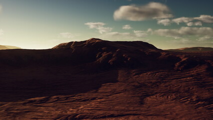 Fototapeta premium Soft light touches a vast red desert landscape. Gentle hills rise in the distance, and the sky is filled with scattered clouds as the sun sets, creating an otherworldly atmosphere.