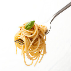 Spaghetti twirled on a fork with a basil leaf on top against a plain white studio background shot