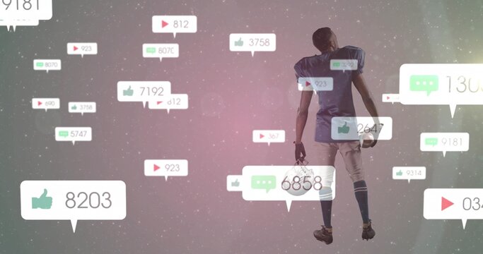 Standing soccer player holding ball in virtual set with floating social icons, counters, copy space