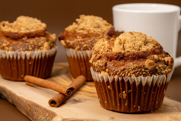 Pumpkin Muffins with Cinnamon and Coffee – Rustic Autumn Breakfast Scene with Warm Light