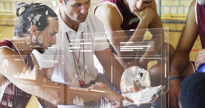 Basketball coach and players wearing jerseys studying holographic data in gym court, with clipboard - Powered by Adobe