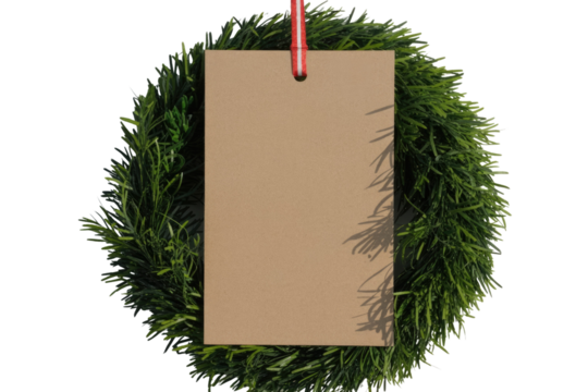 Blank brown paper tag with a festive red and white ribbon, nestled inside a green pine wreath, ready for custom text. background removed