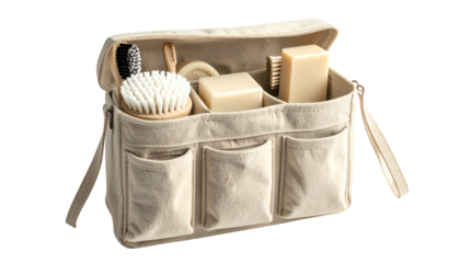 Open toiletry bag with compartments holding brushes and soaps. Canvas material with handles