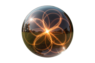 A mesmerizing crystal ball captures luminous orange light trails in intricate patterns, reflecting an outdoor scene of a grassy field and trees. background removed