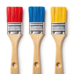 Three paintbrushes with red blue and yellow bristles arranged on a clean white background studio shot