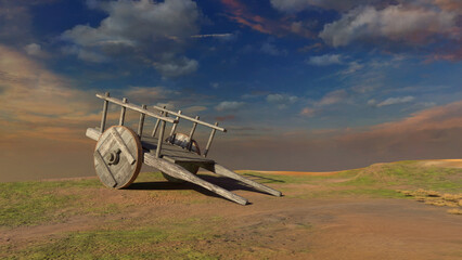 Old wooden cart in a meadow