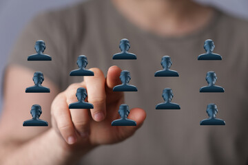 Hand touching network interface representing social connections. Networking and teamwork concept, digital connection, technology and people.