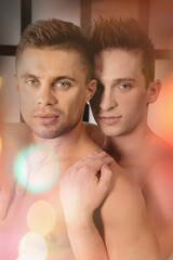 An attractive couple is relaxing on a bed at home