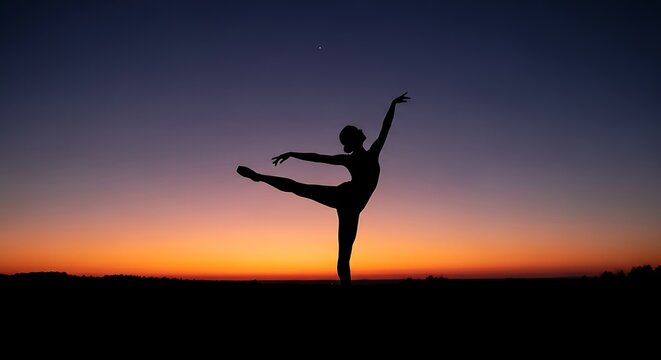 Silhouette of a graceful ballerina dancing during a beautiful sunset.