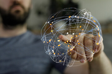 A man's hand cradles a digital globe, representing connectivity, networking, and data visualization.  Ideal for tech, business, and futuristic c