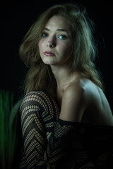 sitting and posing in profile