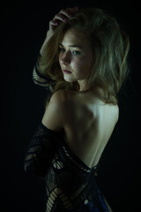 turns around and runs his fingers through his hair