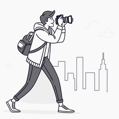 A young man with a backpack and camera walks through a city taking photos with a smile