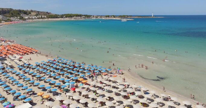 Aerial view of the bay of San Vito Lo Capo, a tourist destination with crystal, clear and turquoise waters located in the province of Trapani, Sicily, Italy. The beach overlooks the Mediterranean sea.