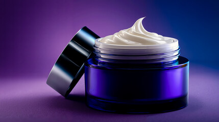 A blue jar of cream with a white swirl on top