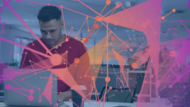 Man opening laptop initiating analytics overlay, reviewing documents as colleague walking past