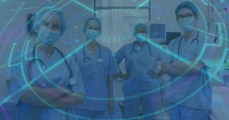 Medical team monitoring diagnostic overlay appearing around them and fading, revealing sharp stance - Powered by Adobe