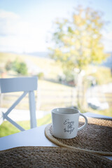 hot drink and open book on cozy kitchen table