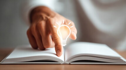 The image portrays a glowing lightbulb over an open book, signifying a brilliant idea.
