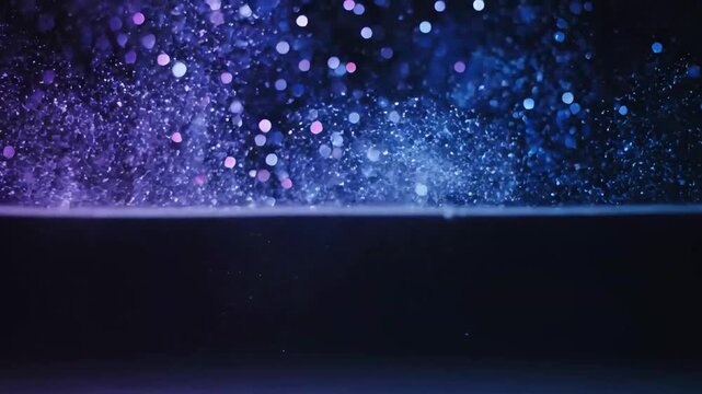 blue-purple glitter and particles crumble onto a black background in the shape of an arch