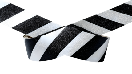 Black and white striped barrier tape in an x shape for safety and caution signage
