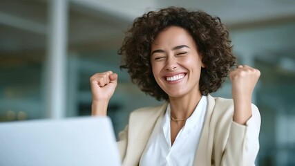 Young professional woman in office reacting with joy at laptop screen, receiving bonus or good - Powered by Adobe