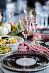 Elegant disco table setting with pink glassware