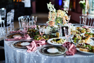 Elegant disco table setting with pink glassware