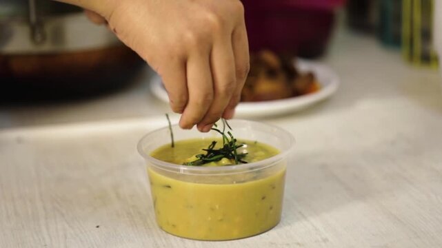 Serving Freshly cooked food. Spicy Indian food Dal tadka.