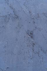 A solid colored background with a distinct, uneven texture