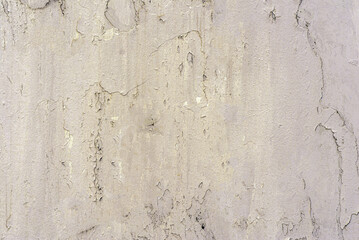 A solid colored background with a distinct, uneven texture