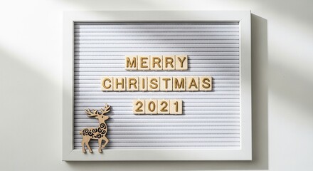Merry christmas 2021 text on a letter board with reindeer decoration no logo use